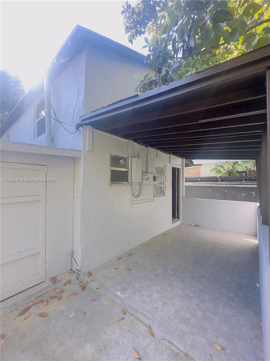 276 East 12th Street Hialeah, FL 33010 - Photo 18 of 27 a view of a house with porch and wooden fence