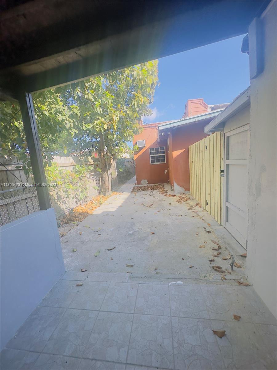 276 East 12th Street Hialeah, FL 33010 - Photo 19 of 27 a view of a big room with wooden floor and windows
