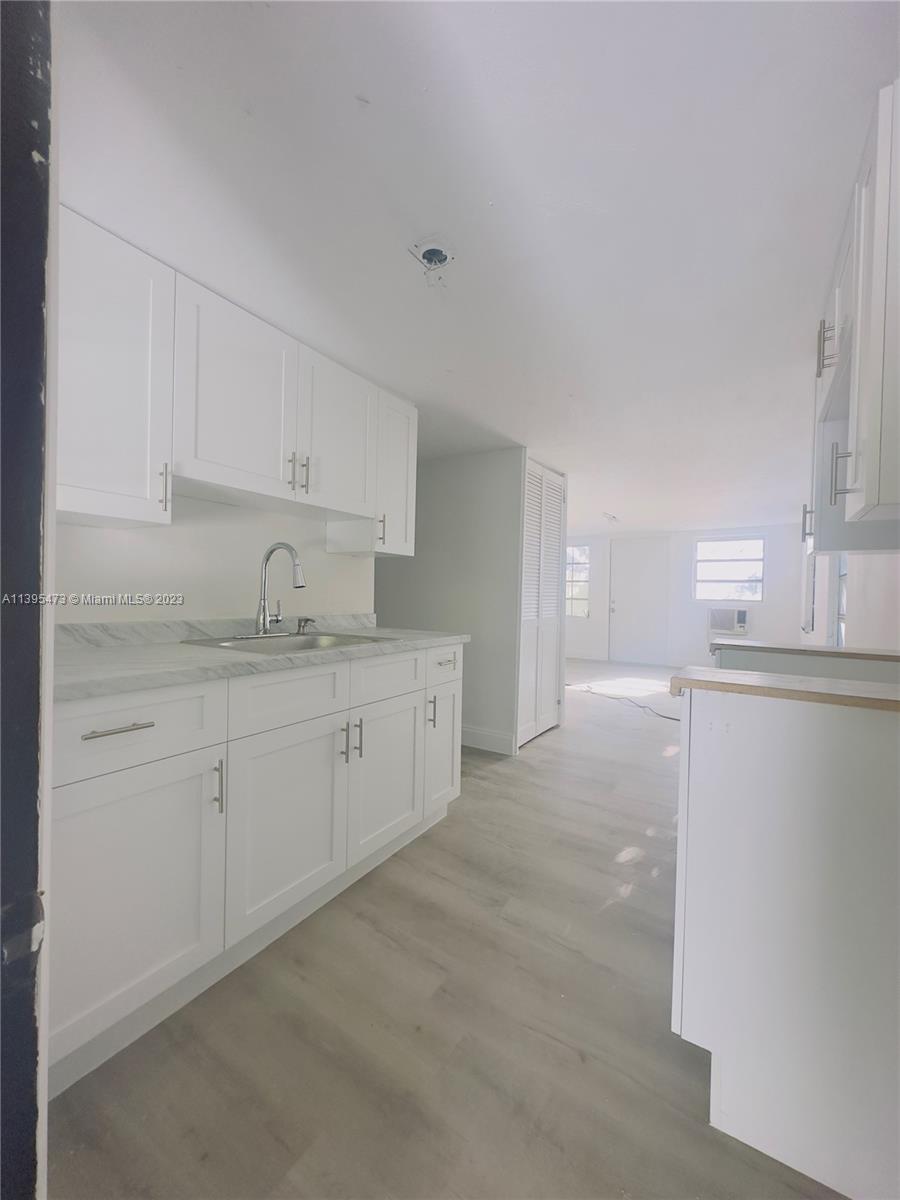 276 East 12th Street Hialeah, FL 33010 - Photo 20 of 27 a kitchen with cabinets and a sink