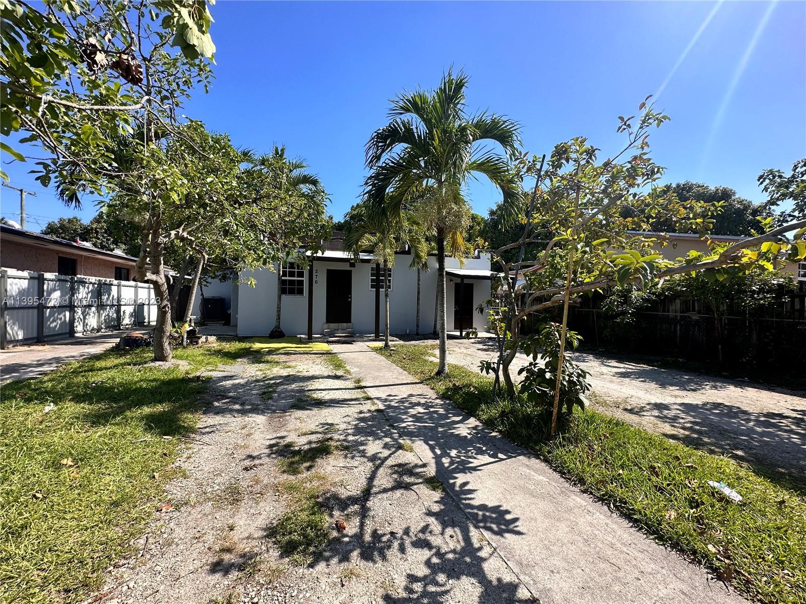 276 East 12th Street Hialeah, FL 33010 - Photo 2 of 27 a view of a house with backyard and sitting area