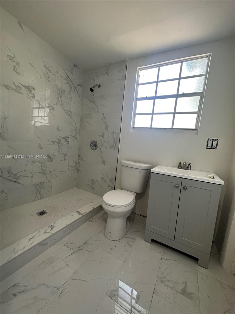 276 East 12th Street Hialeah, FL 33010 - Photo 6 of 27 a bathroom with a toilet sink and a bathtub