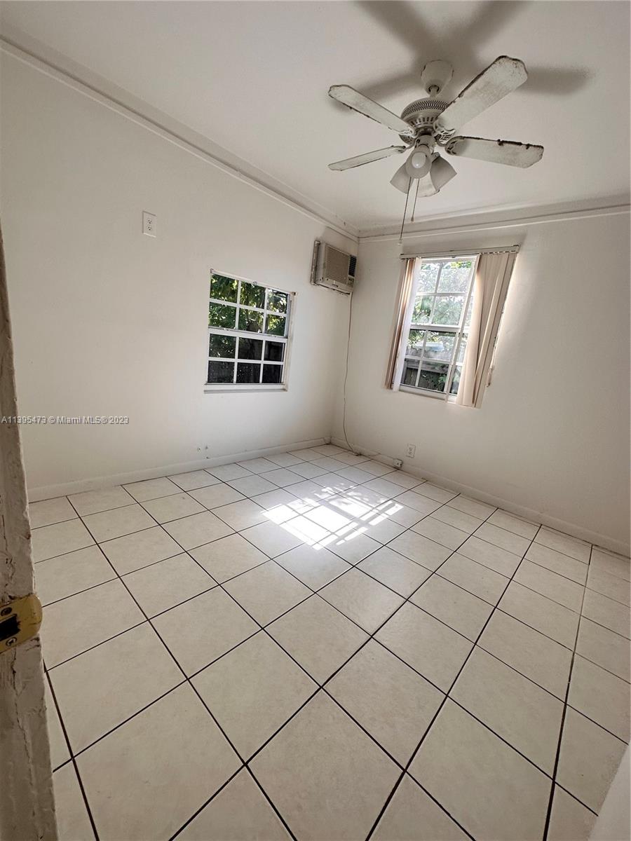 276 East 12th Street Hialeah, FL 33010 - Photo 7 of 27 a view of empty room with windows