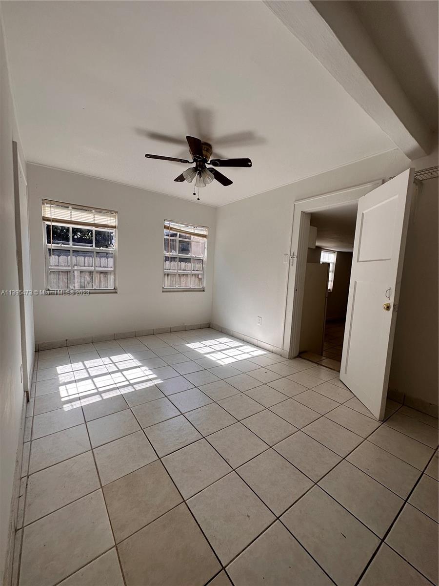 276 East 12th Street Hialeah, FL 33010 - Photo 9 of 27 a view of an empty room with a window