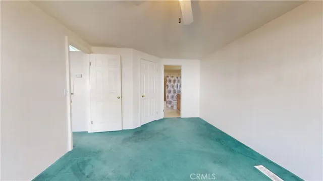a view of a bathroom from a hallway