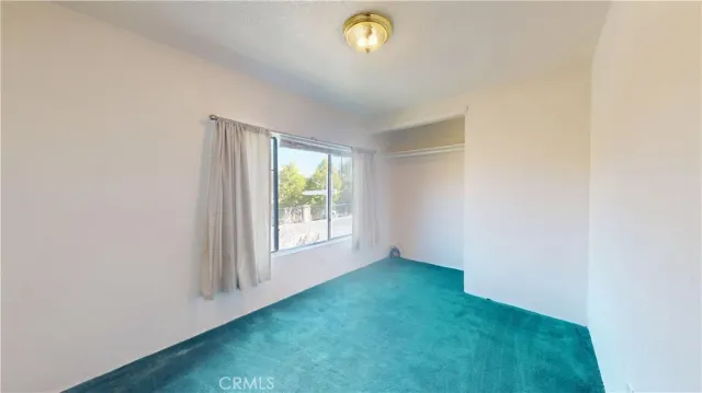 a view of a room with a large window