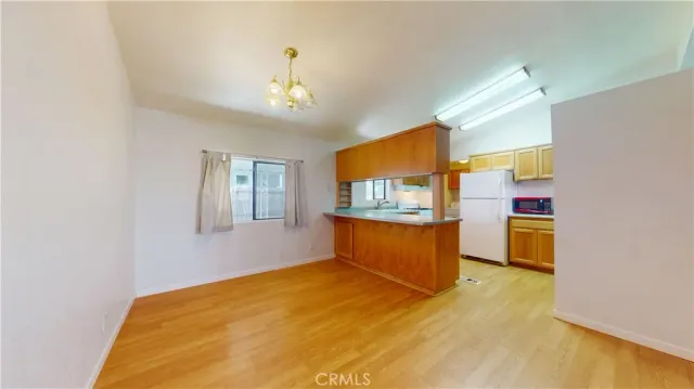 a bedroom with a bed and a television