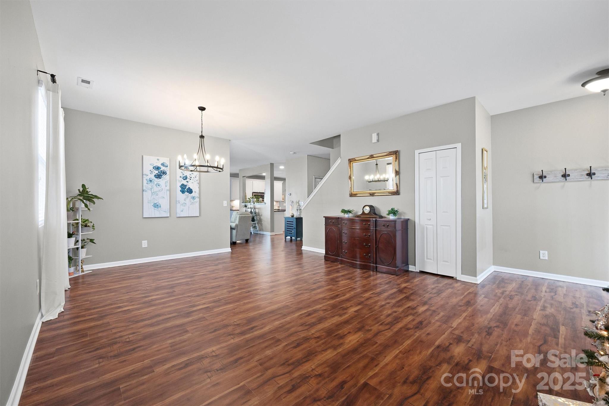 422 Garden Grove Road Fort Mill, SC 29708 - Photo 12 of 39 a view of a big room with wooden floor and windows