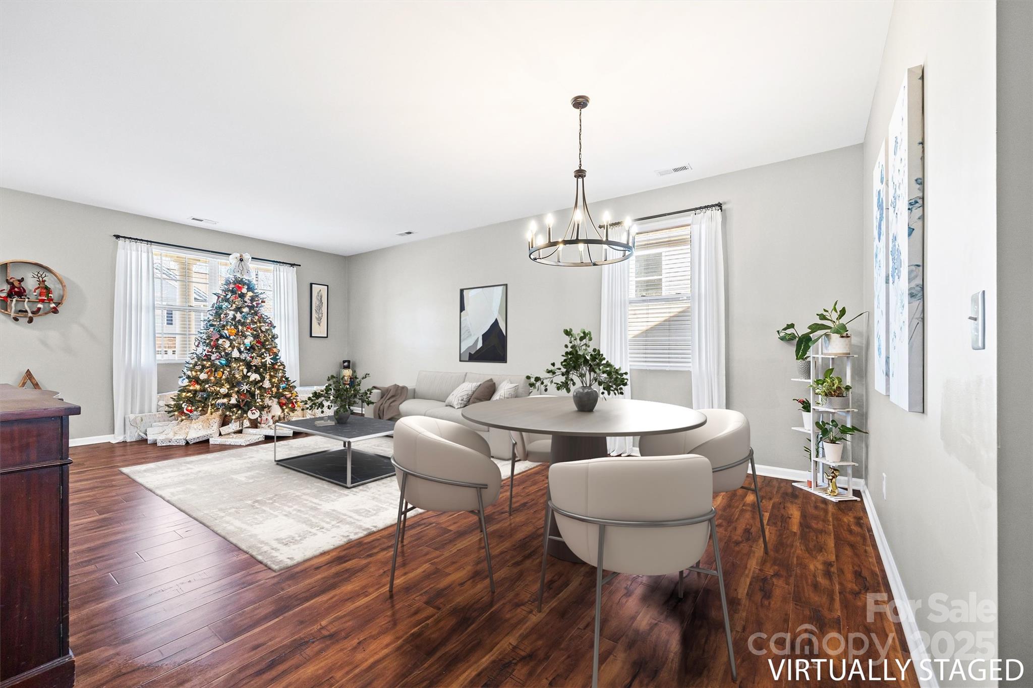 422 Garden Grove Road Fort Mill, SC 29708 - Photo 13 of 39 a view of a dining room with furniture wooden floor and chandelier