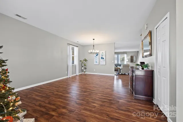 a bedroom with a bed and a television