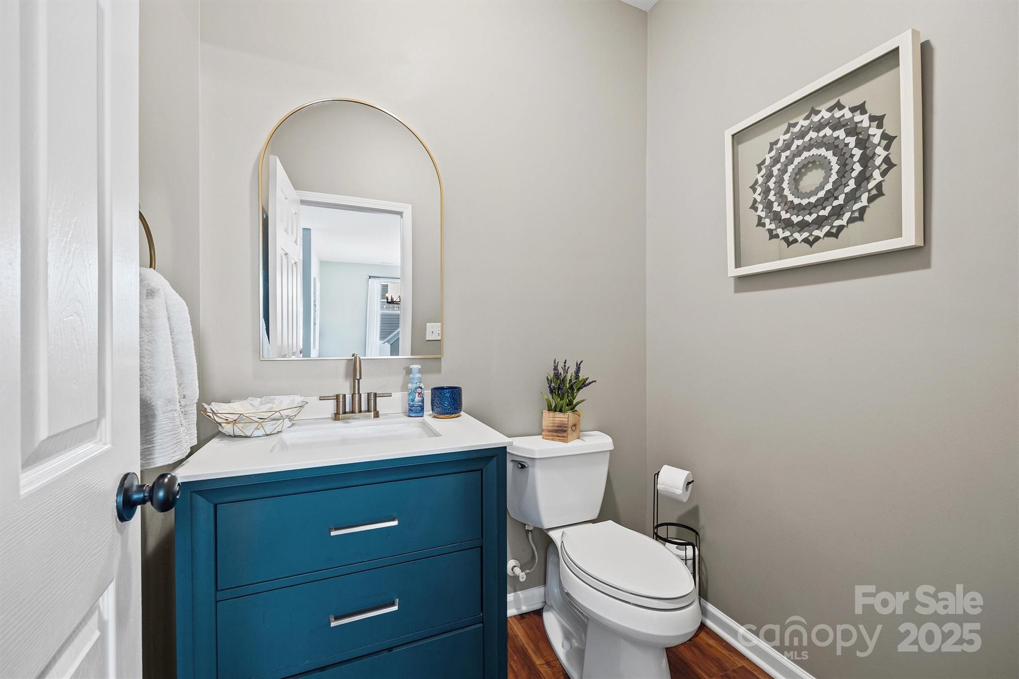 422 Garden Grove Road Fort Mill, SC 29708 - Photo 17 of 39 a bathroom with a toilet a sink and mirror