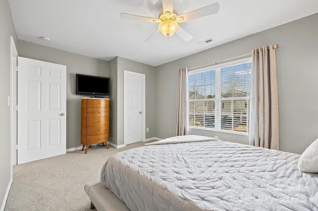 a spacious bathroom with a double vanity sink mirror and