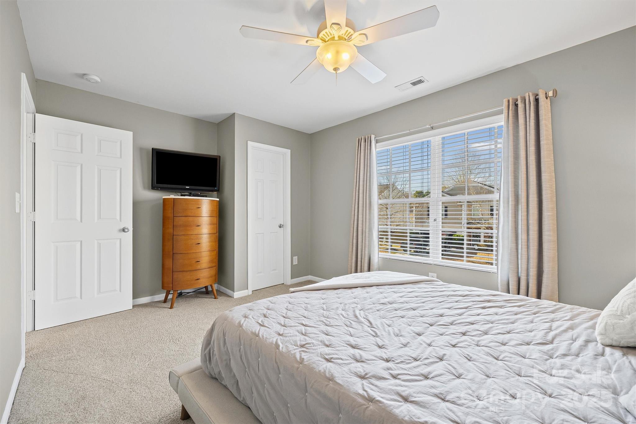 422 Garden Grove Road Fort Mill, SC 29708 - Photo 22 of 39 a bedroom with a bed and a television