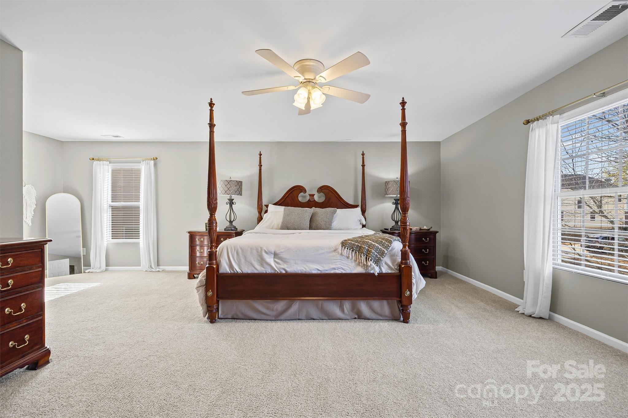 422 Garden Grove Road Fort Mill, SC 29708 - Photo 24 of 39 a bedroom with a bed window and a ceiling fan