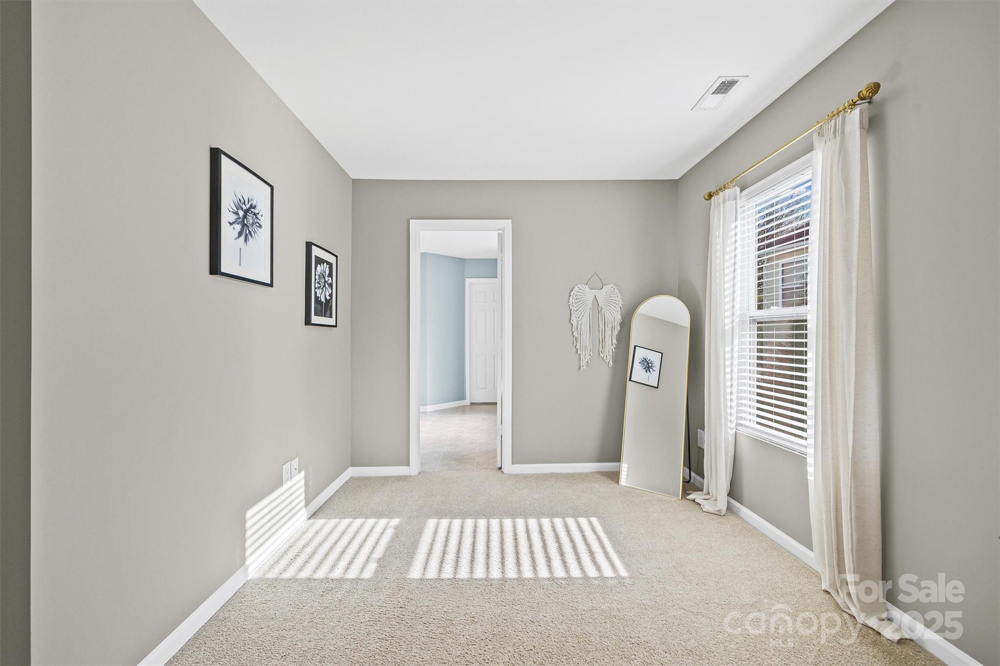422 Garden Grove Road Fort Mill, SC 29708 - Photo 27 of 39 a bedroom with a bed and a window