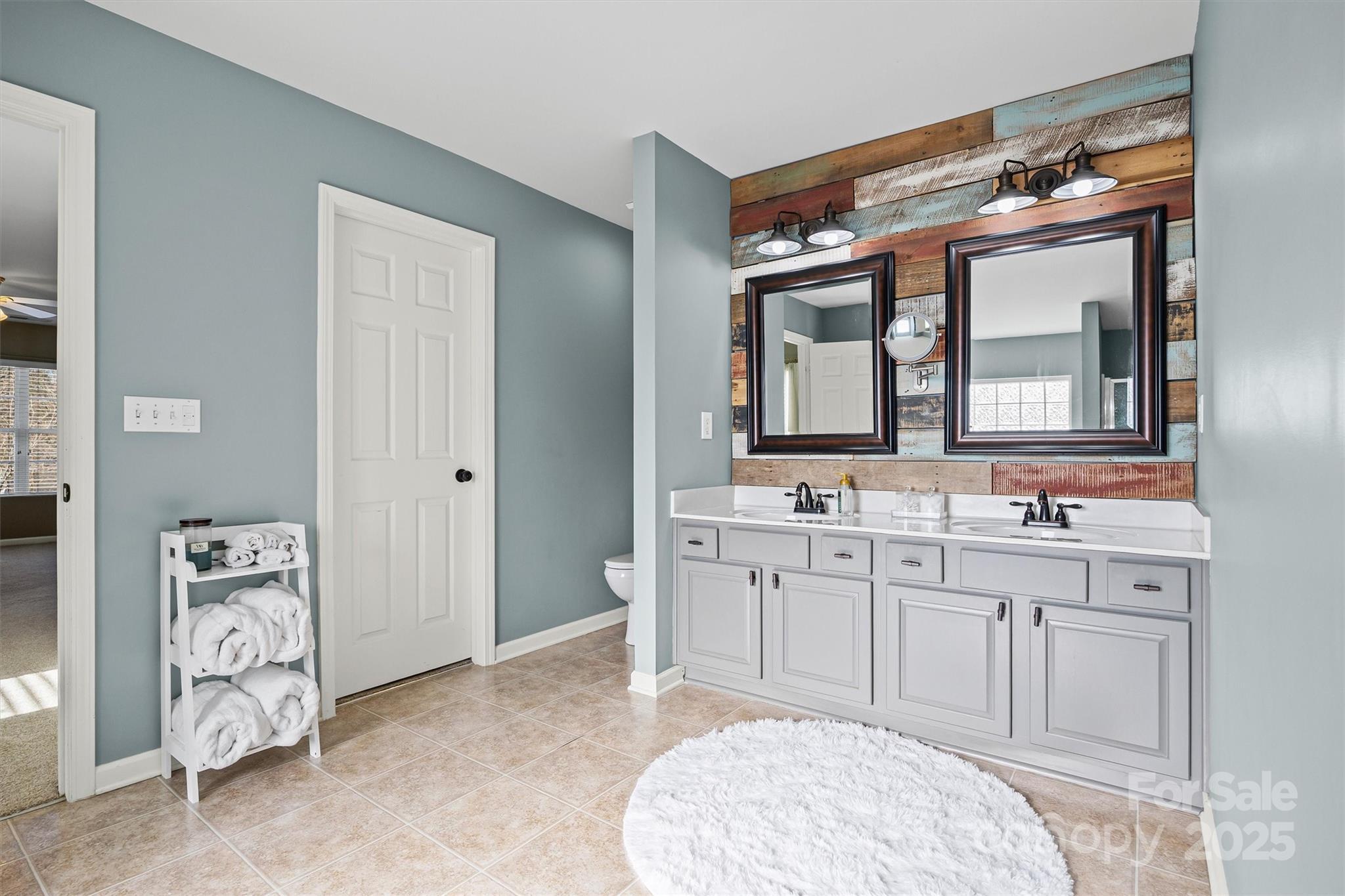 422 Garden Grove Road Fort Mill, SC 29708 - Photo 28 of 39 a spacious bathroom with a double vanity sink mirror and