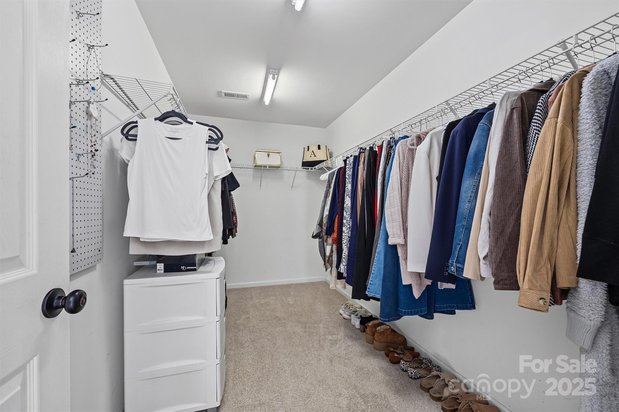422 Garden Grove Road Fort Mill, SC 29708 - Photo 30 of 39 a view of walk in closet with clothes