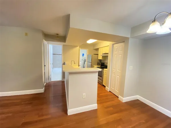 a view of kitchen with furniture and wooden floor