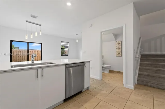 a view of a kitchen from the hallway