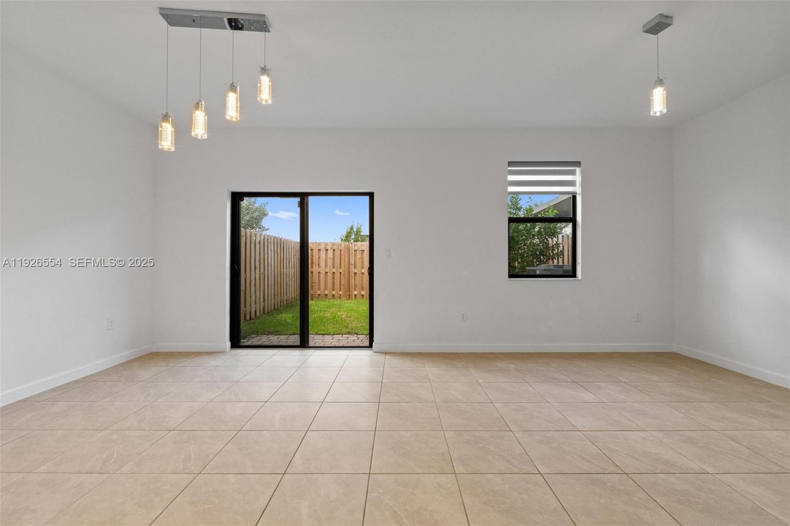 23016 Southwest 129th Court Miami, FL 33177 - Photo 14 of 39 an empty room with windows and closet