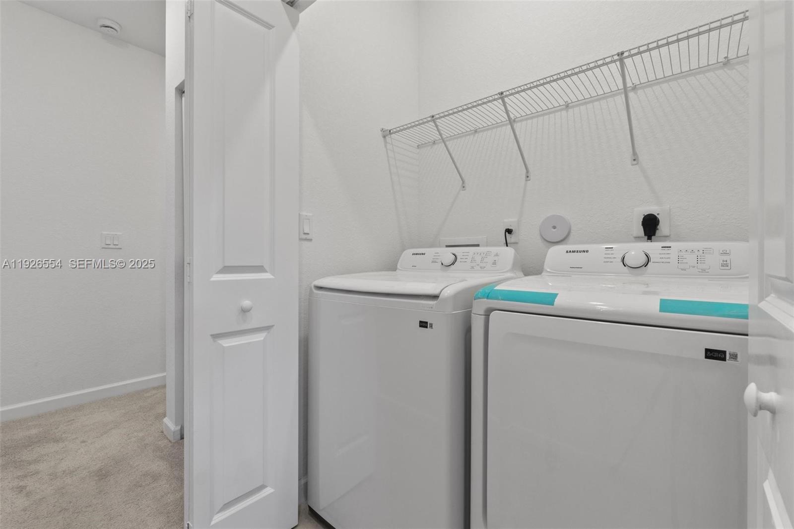 23016 Southwest 129th Court Miami, FL 33177 - Photo 21 of 39 a utility room with dryer and washer