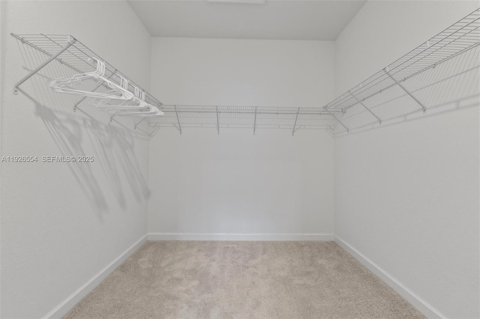 23016 Southwest 129th Court Miami, FL 33177 - Photo 24 of 39 a view of a room with racks on the wall