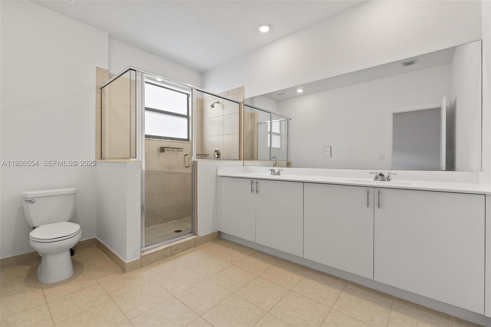 23016 Southwest 129th Court Miami, FL 33177 - Photo 25 of 39 a bathroom with a sink and a toilet