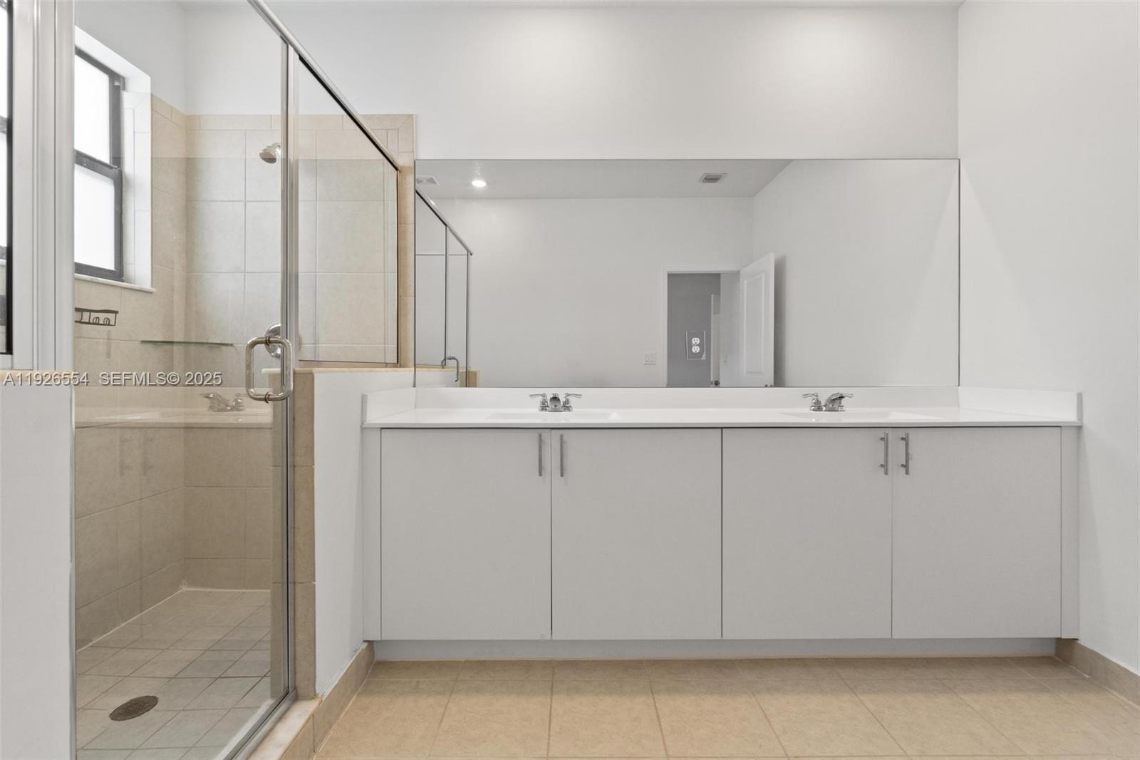23016 Southwest 129th Court Miami, FL 33177 - Photo 26 of 39 a bathroom with a granite countertop sink and a mirror