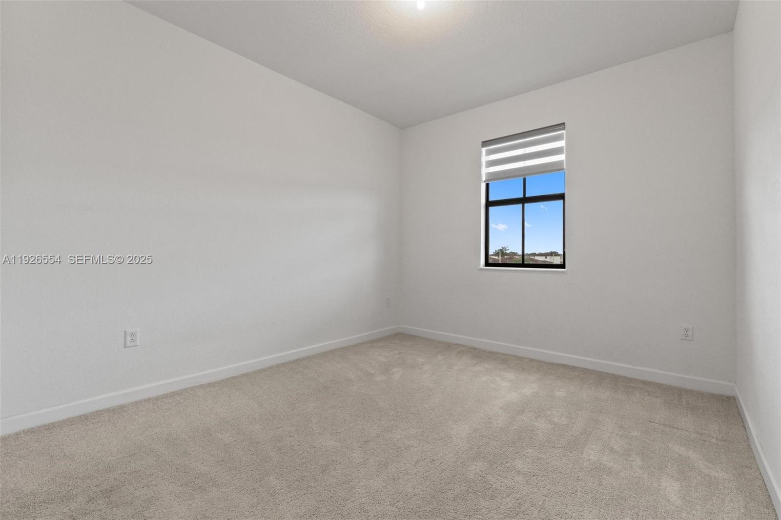 23016 Southwest 129th Court Miami, FL 33177 - Photo 27 of 39 an empty room with a window