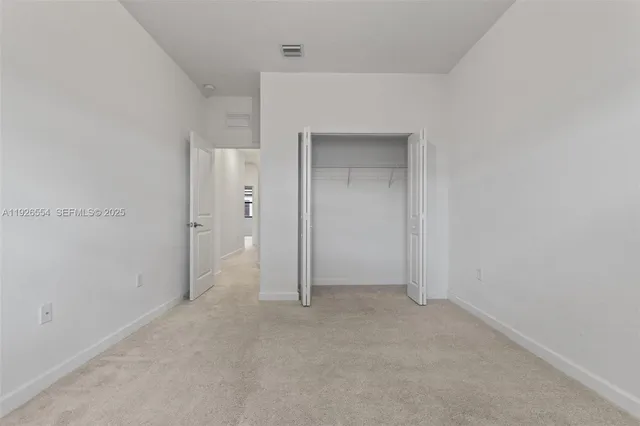 a view of room with window and stairs