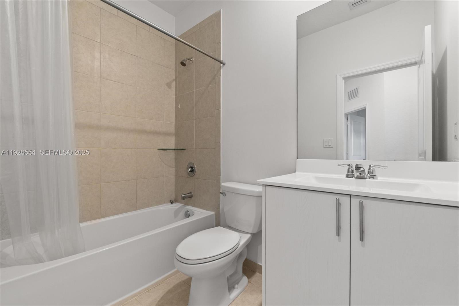 23016 Southwest 129th Court Miami, FL 33177 - Photo 29 of 39 a bathroom with a sink a toilet and shower