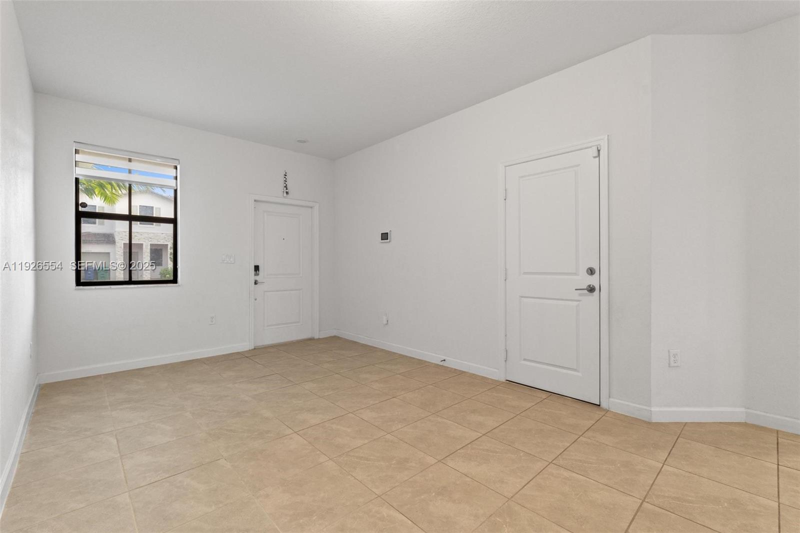 23016 Southwest 129th Court Miami, FL 33177 - Photo 6 of 39 an empty room with windows