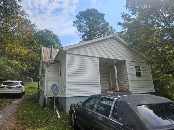 a view of a house with a back yard
