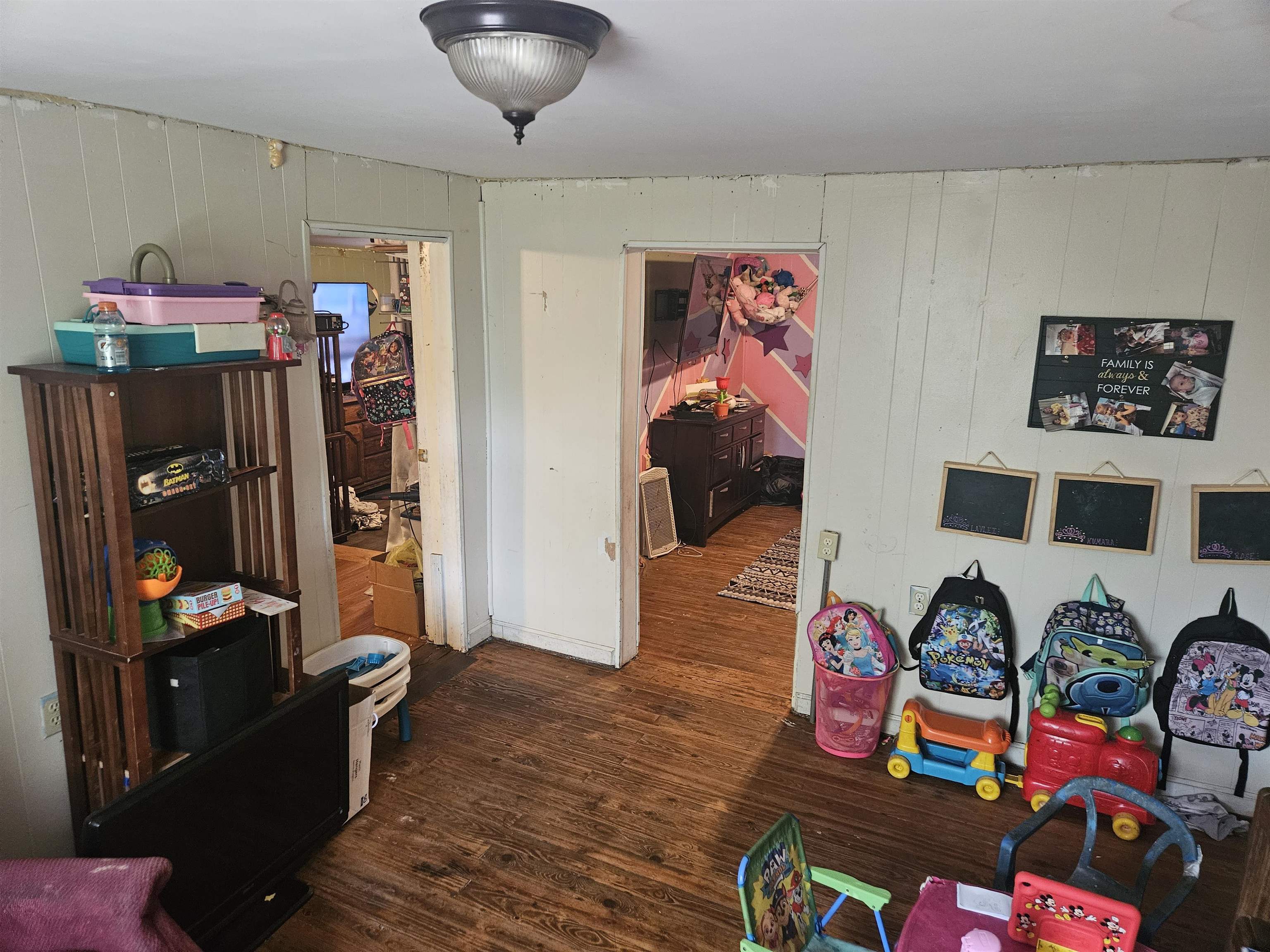 850 Defeated Creek Road Centerville, TN 37033 - Photo 11 of 17 a living room with lots of furniture and book shelf