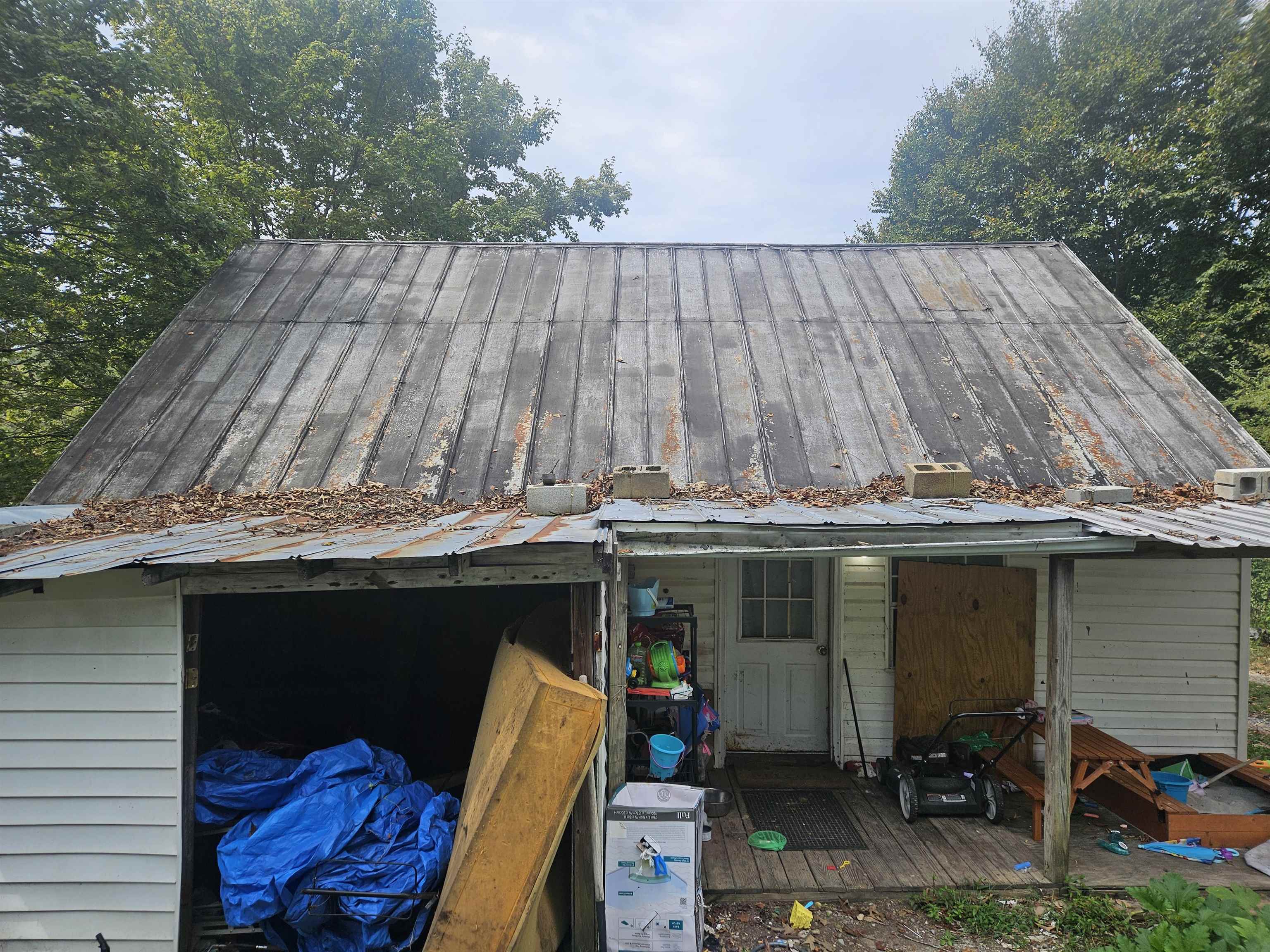 850 Defeated Creek Road Centerville, TN 37033 - Photo 5 of 17 a side view of small house with backyard and seating space