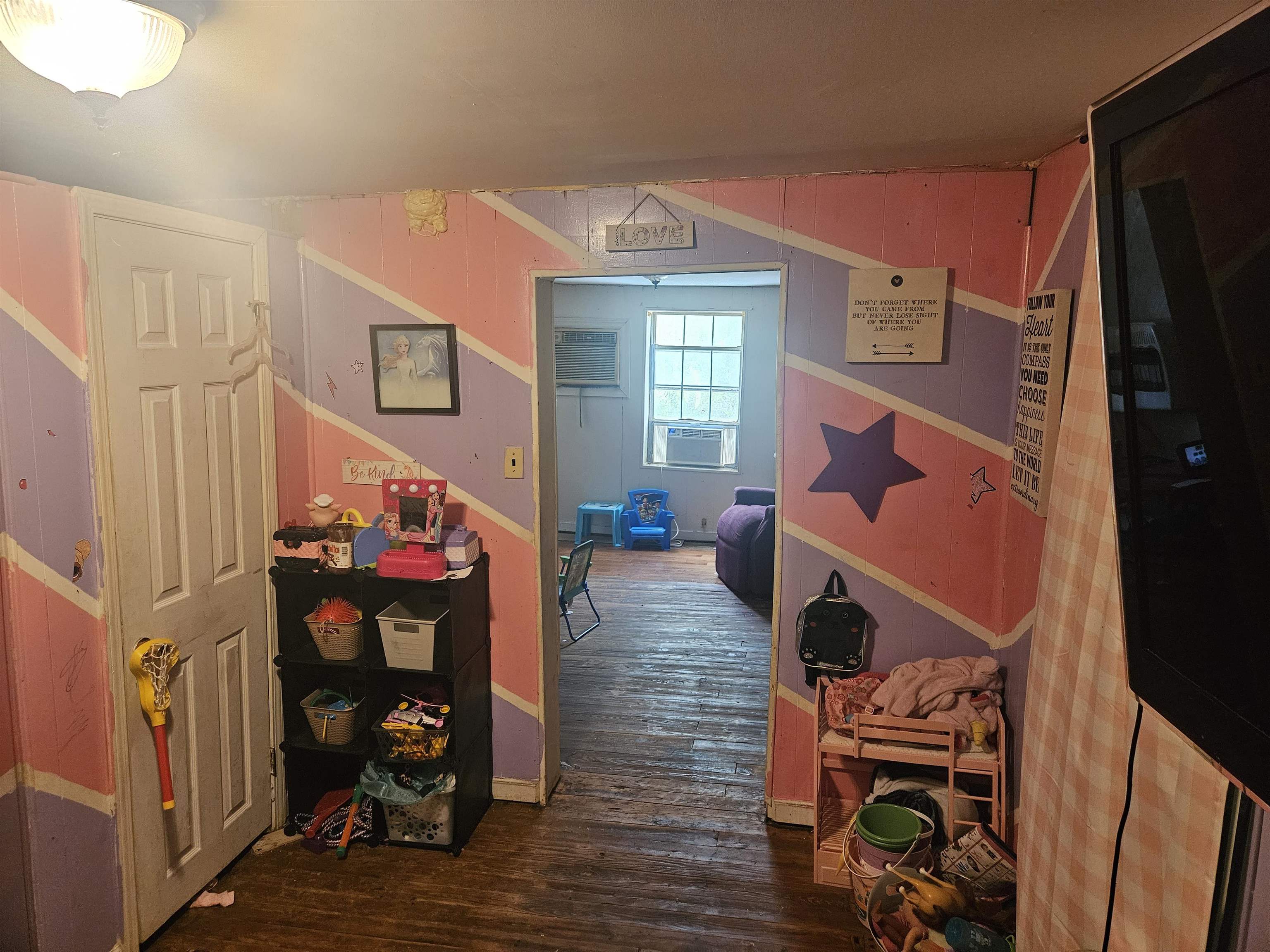 850 Defeated Creek Road Centerville, TN 37033 - Photo 7 of 17 a living room with furniture a fireplace and wooden floor