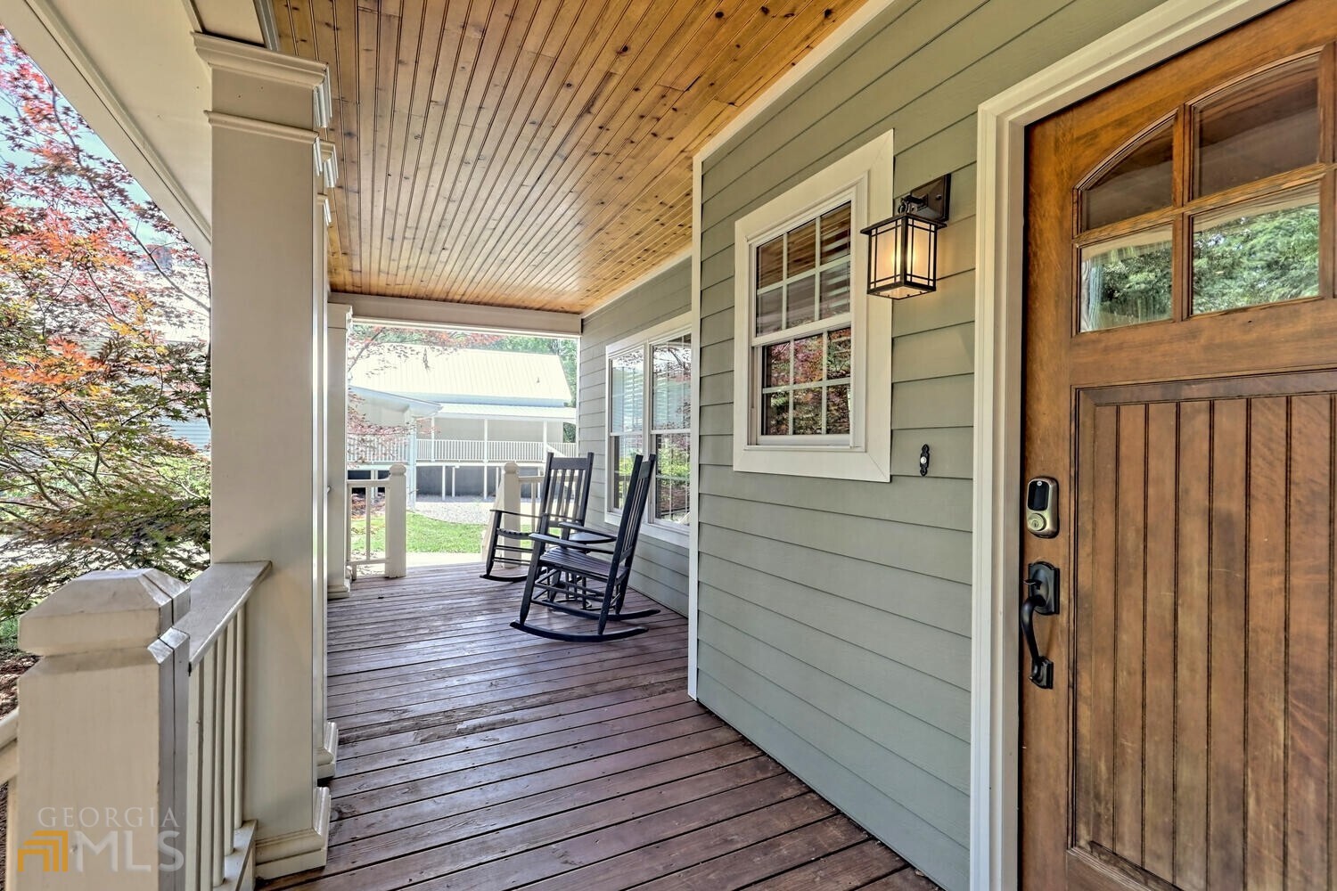 643 Washington Street Clarkesville, GA 30523 - Photo 11 of 56 a view of a porch with wooden floor