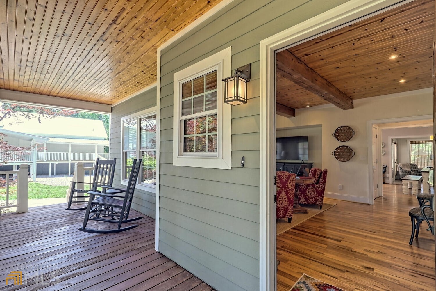 643 Washington Street Clarkesville, GA 30523 - Photo 13 of 56 a view of a deck with wooden floor and seating space