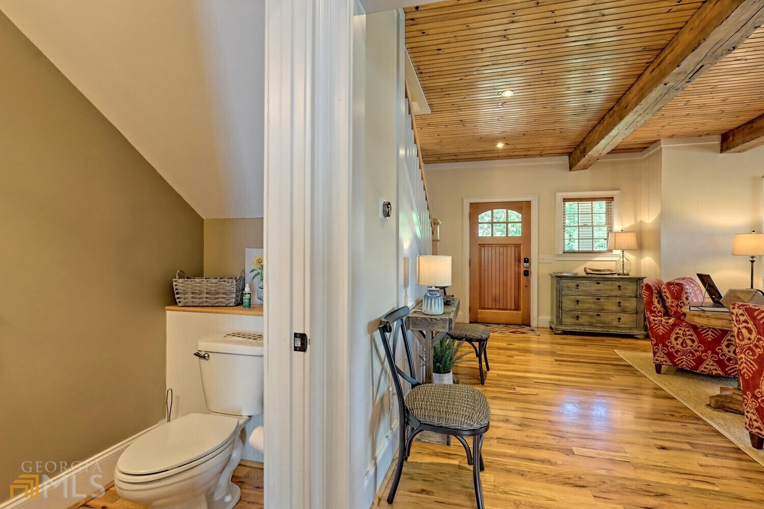 643 Washington Street Clarkesville, GA 30523 - Photo 33 of 56 a living room with furniture and a toilet