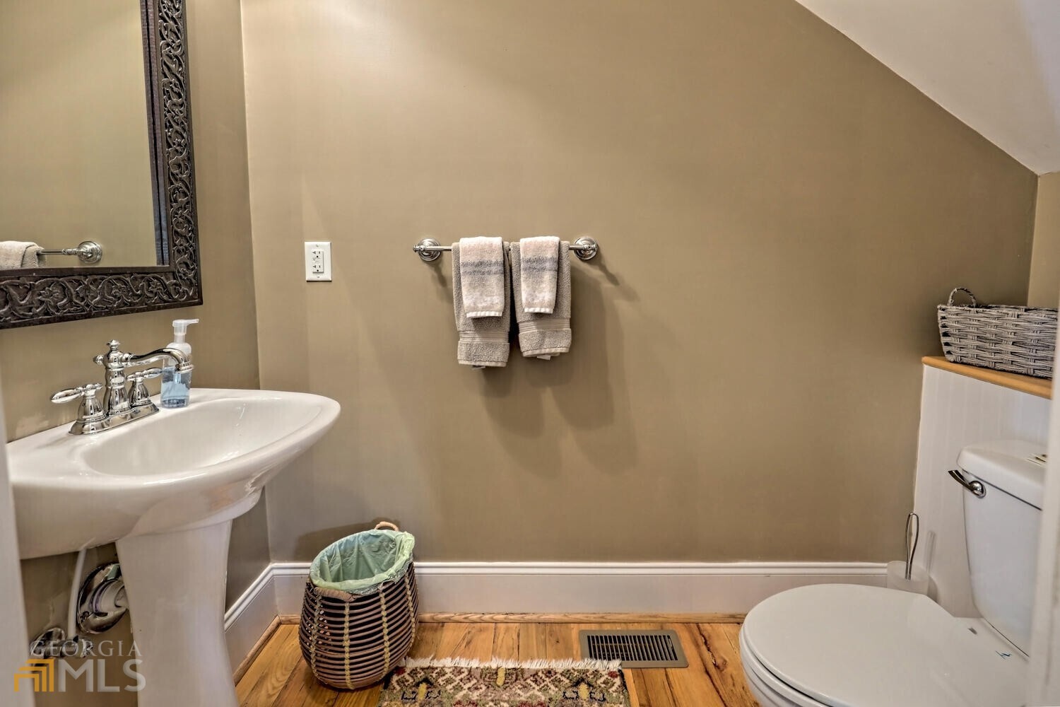 643 Washington Street Clarkesville, GA 30523 - Photo 34 of 56 a bathroom with a sink toilet and mirror