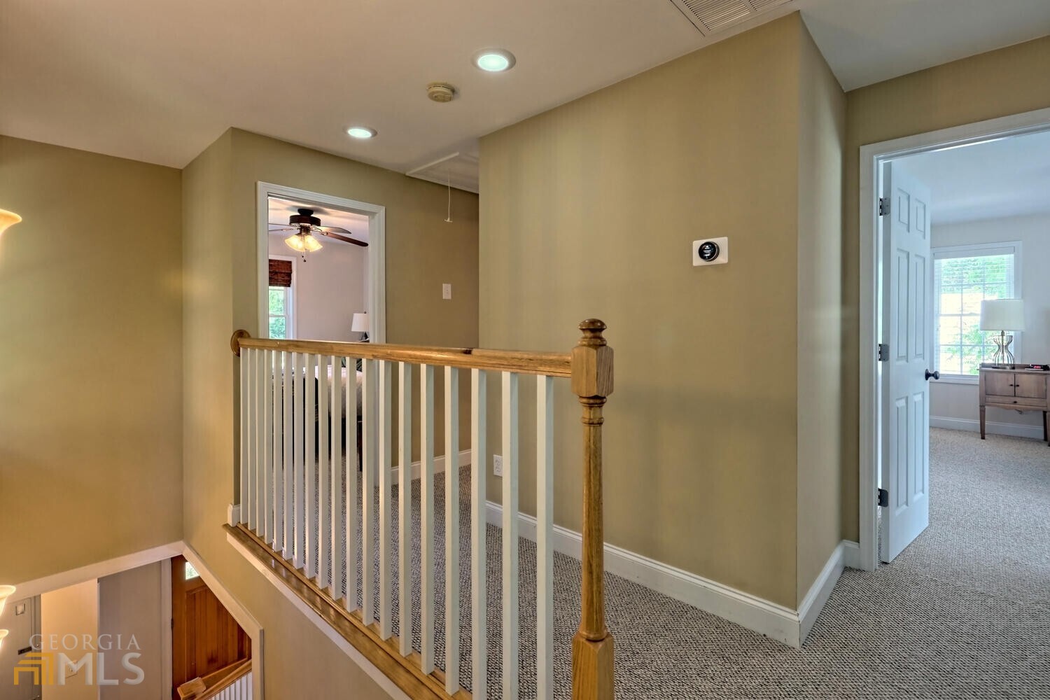 643 Washington Street Clarkesville, GA 30523 - Photo 38 of 56 a view of a hallway with a livingroom and a bathroom with sink