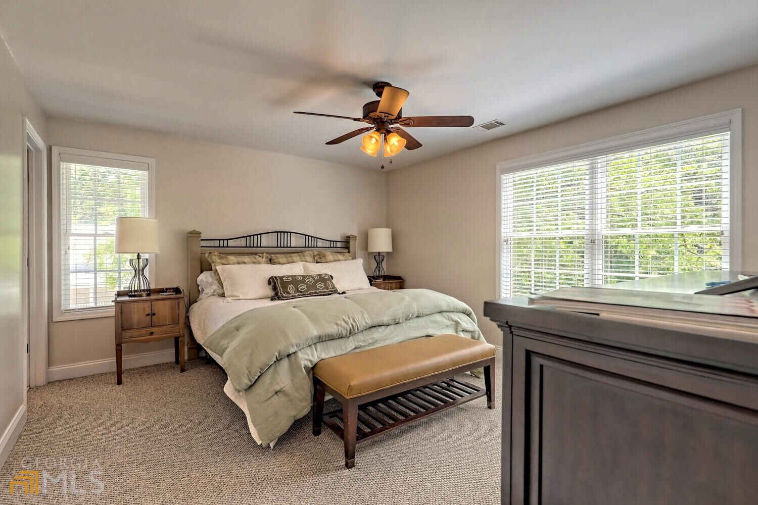 643 Washington Street Clarkesville, GA 30523 - Photo 39 of 56 a bedroom with a bed and a chandelier