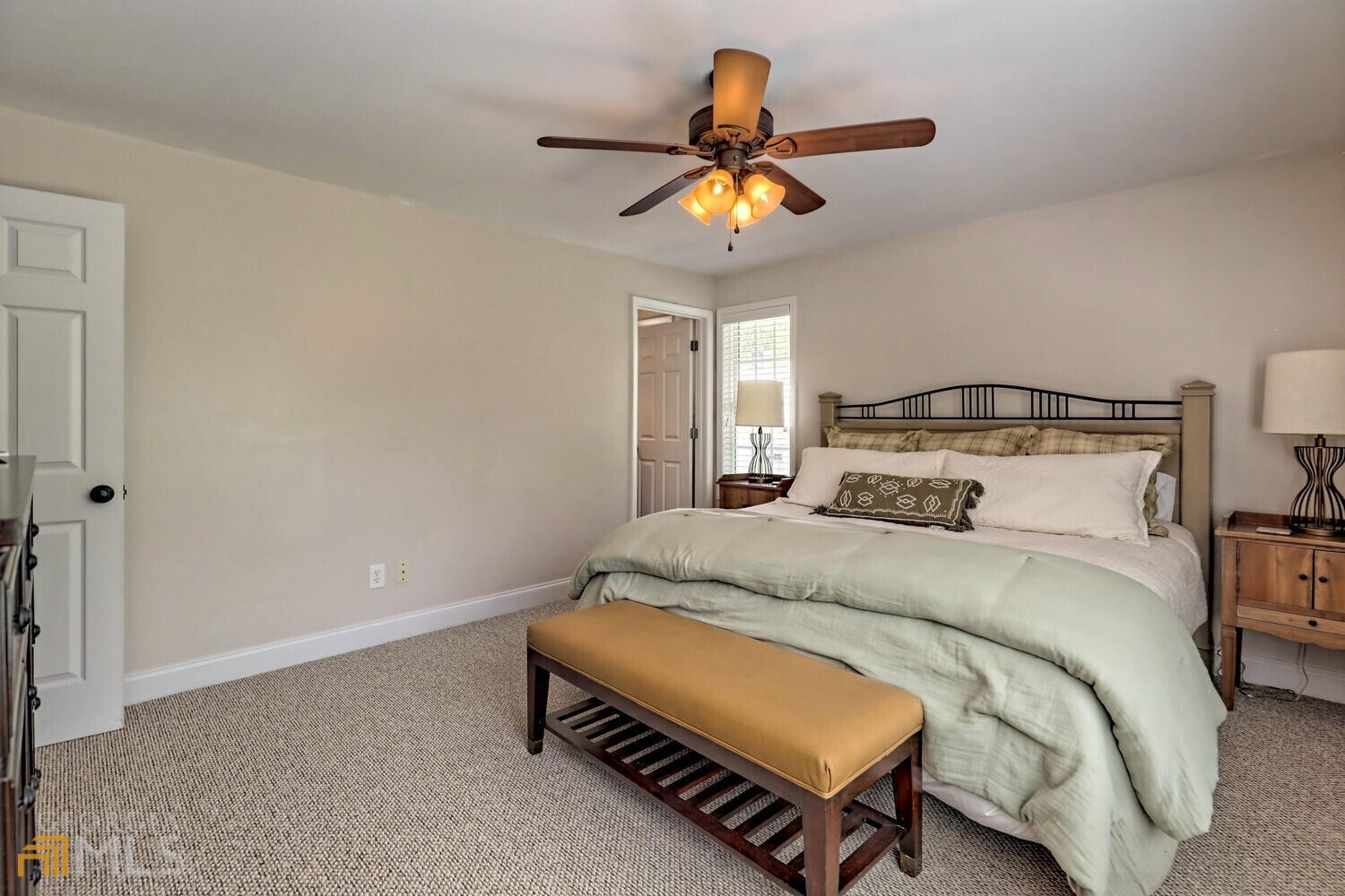 643 Washington Street Clarkesville, GA 30523 - Photo 40 of 56 a bedroom with a bed and a ceiling fan