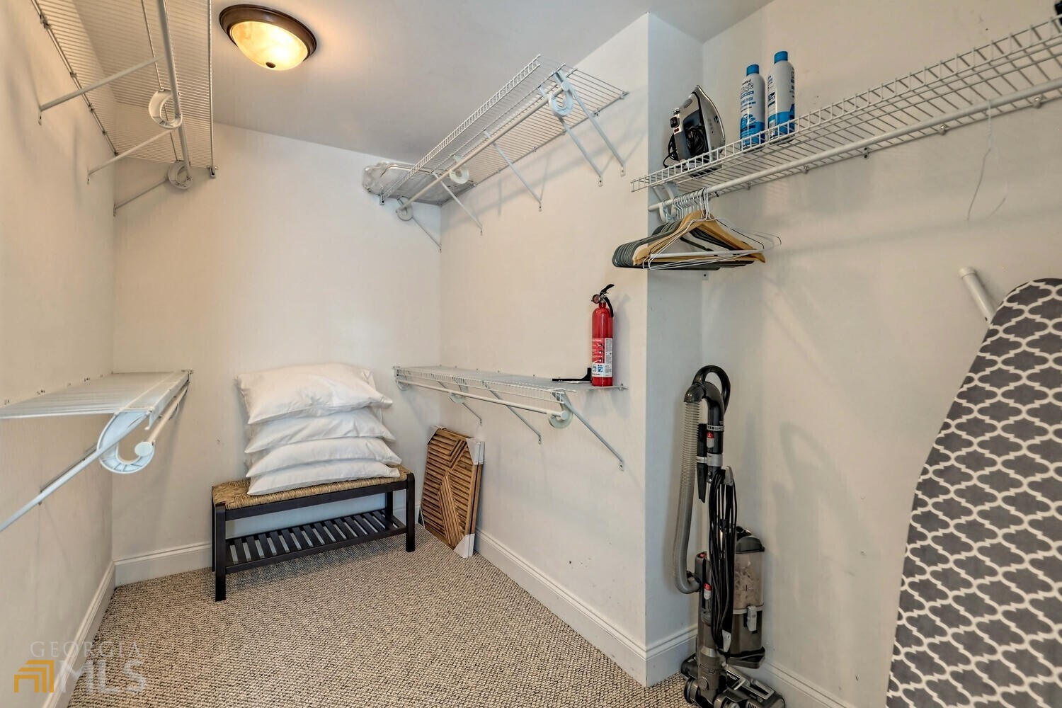 643 Washington Street Clarkesville, GA 30523 - Photo 42 of 56 a view of walk in closet with clothes and shoes