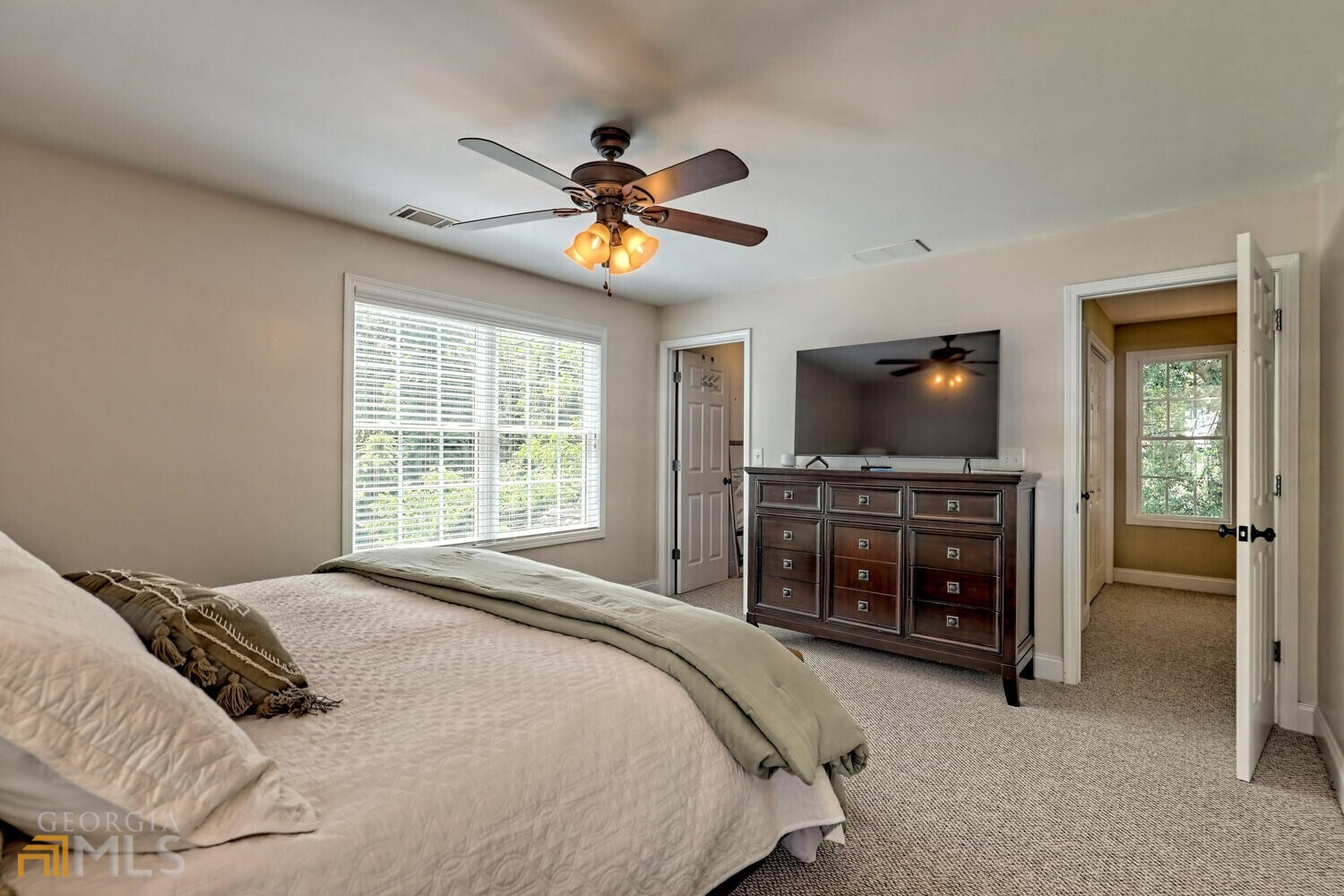 643 Washington Street Clarkesville, GA 30523 - Photo 45 of 56 a bedroom with a bed and a flat screen tv