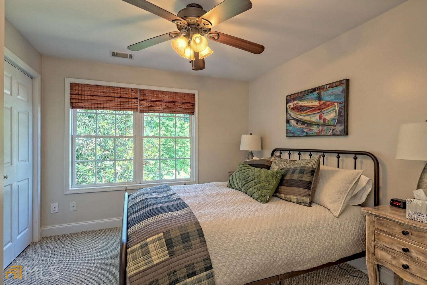 643 Washington Street Clarkesville, GA 30523 - Photo 48 of 56 a bedroom with a bed and a chandelier