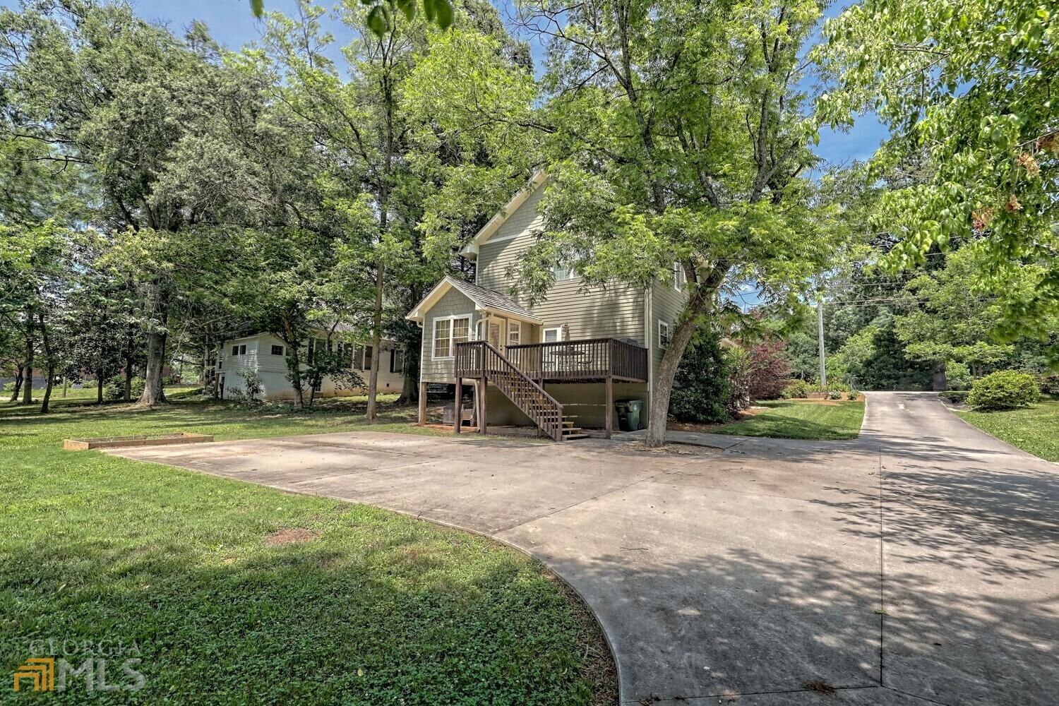 643 Washington Street Clarkesville, GA 30523 - Photo 5 of 56 a front view of a house with a yard and trees