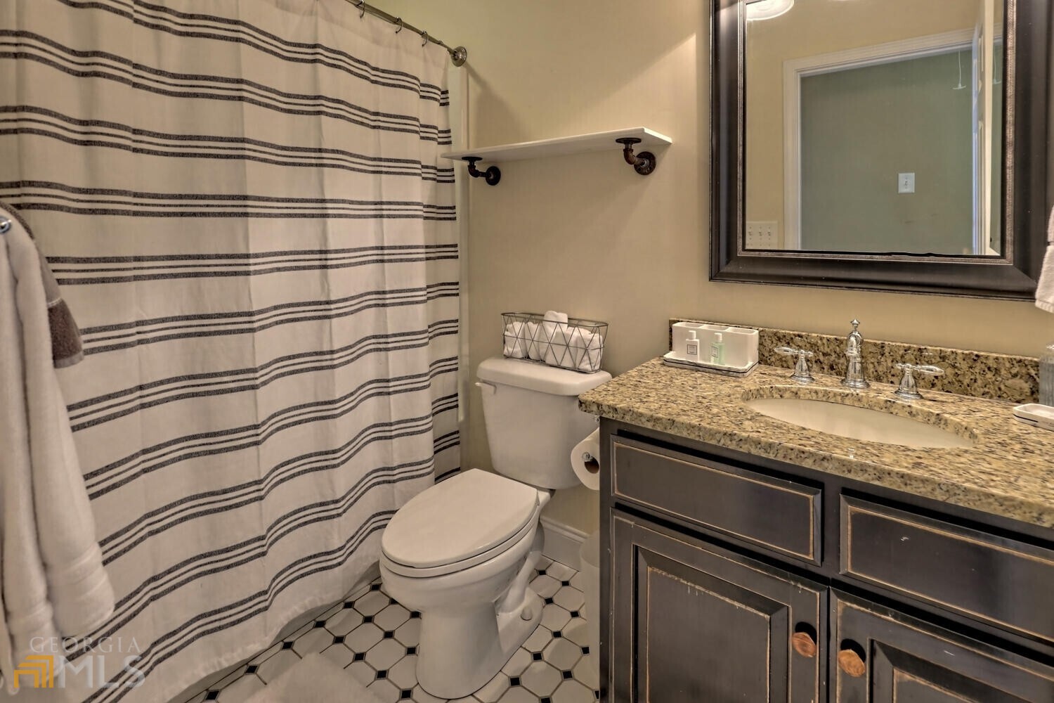 643 Washington Street Clarkesville, GA 30523 - Photo 52 of 56 a bathroom with a granite countertop sink toilet and shower
