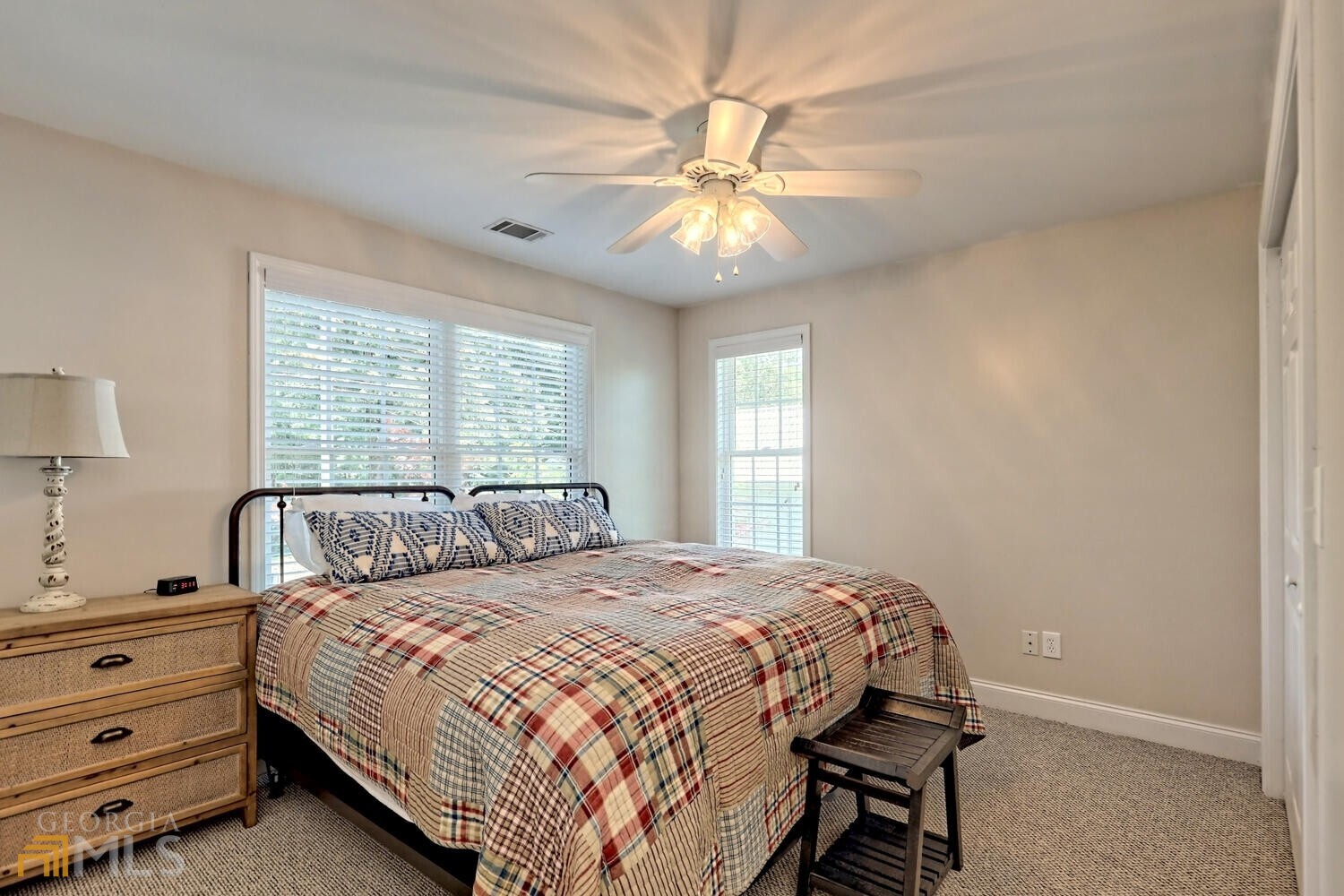 643 Washington Street Clarkesville, GA 30523 - Photo 53 of 56 a bedroom with a bed and a chandelier