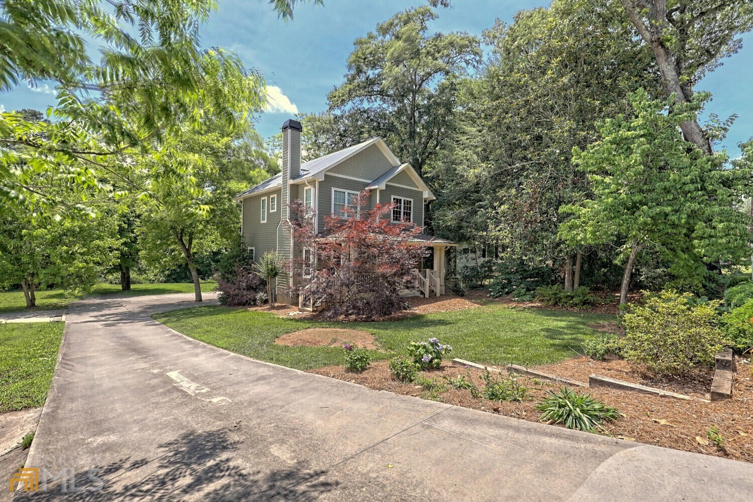 643 Washington Street Clarkesville, GA 30523 - Photo 9 of 56 a front view of a house with a yard and garage