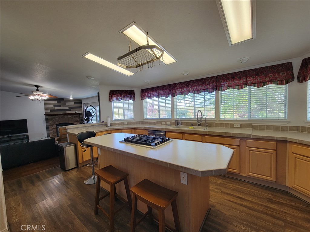 58804 Ramsey Road Anza, CA 92539 - Photo 12 of 51 a kitchen with a table chairs stove and wooden floor
